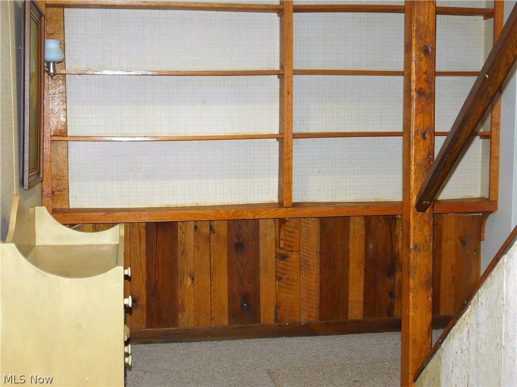 6939 Case Road North Ridgeville, OH 44039 - Photo 31 of 35 Built-in book shelves at bottom of basement stairs.