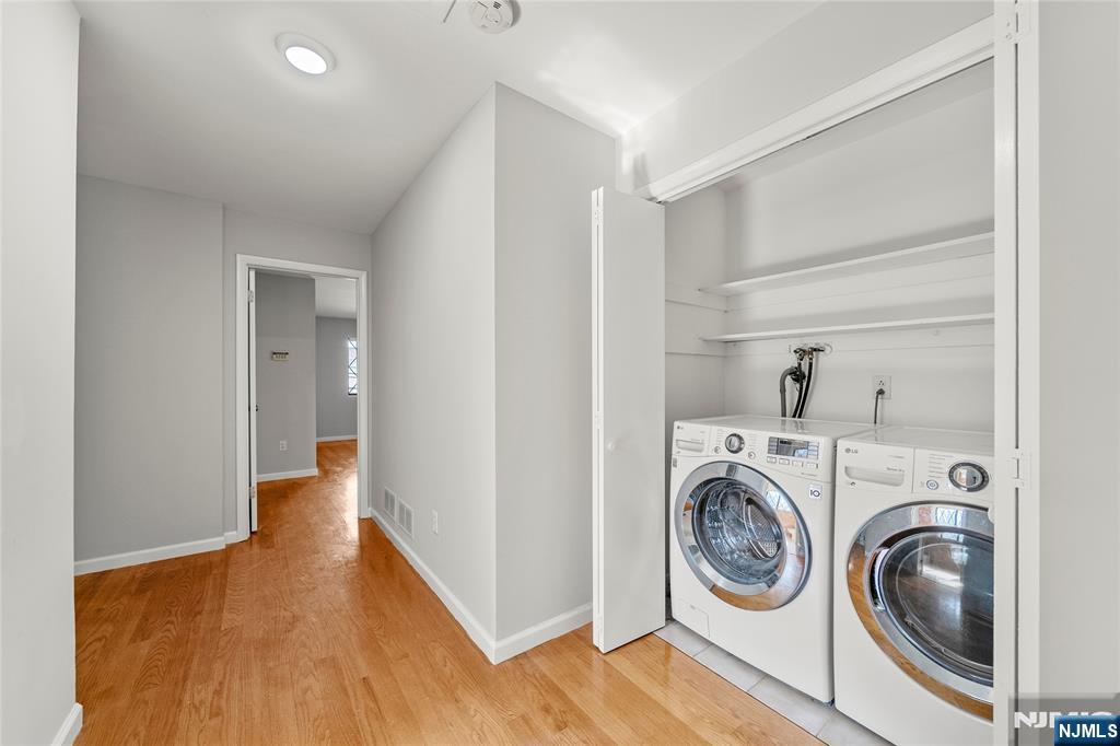 121 Broadway Cresskill, NJ 07626 - Photo 14 of 17 a view of hallway with washer and dryer