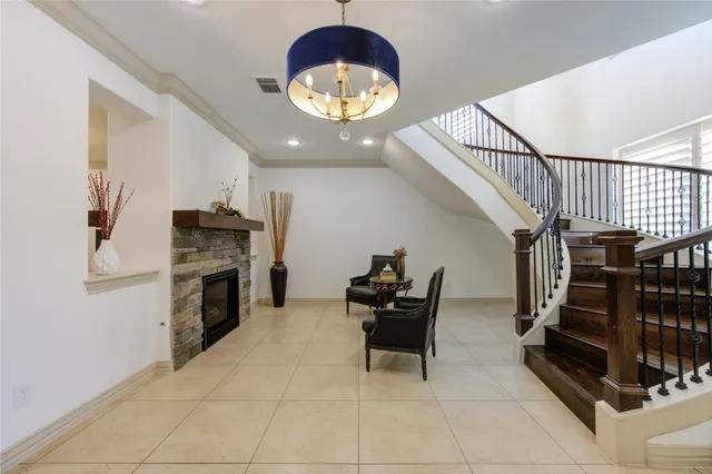 a view of a livingroom with furniture and staircase