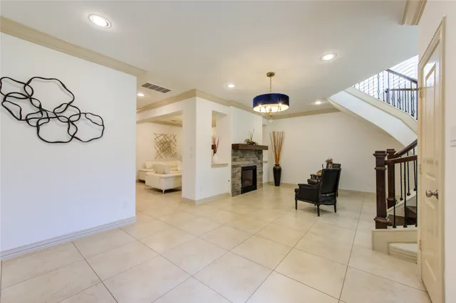 a view of living room filled with furniture and white walls