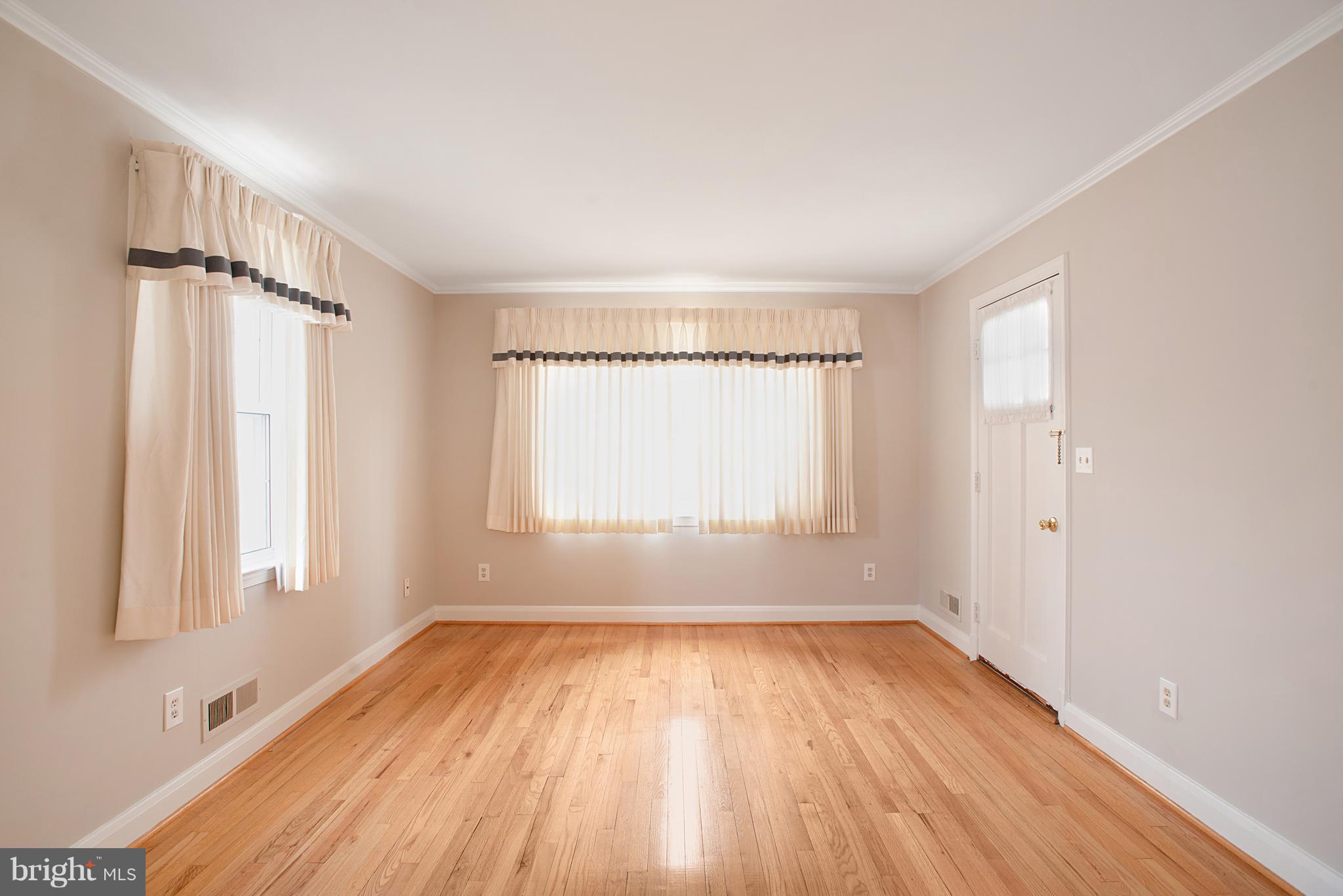 3300 Garnet Road Baltimore, MD 21234 - Photo 13 of 55 an empty room with wooden floor and windows