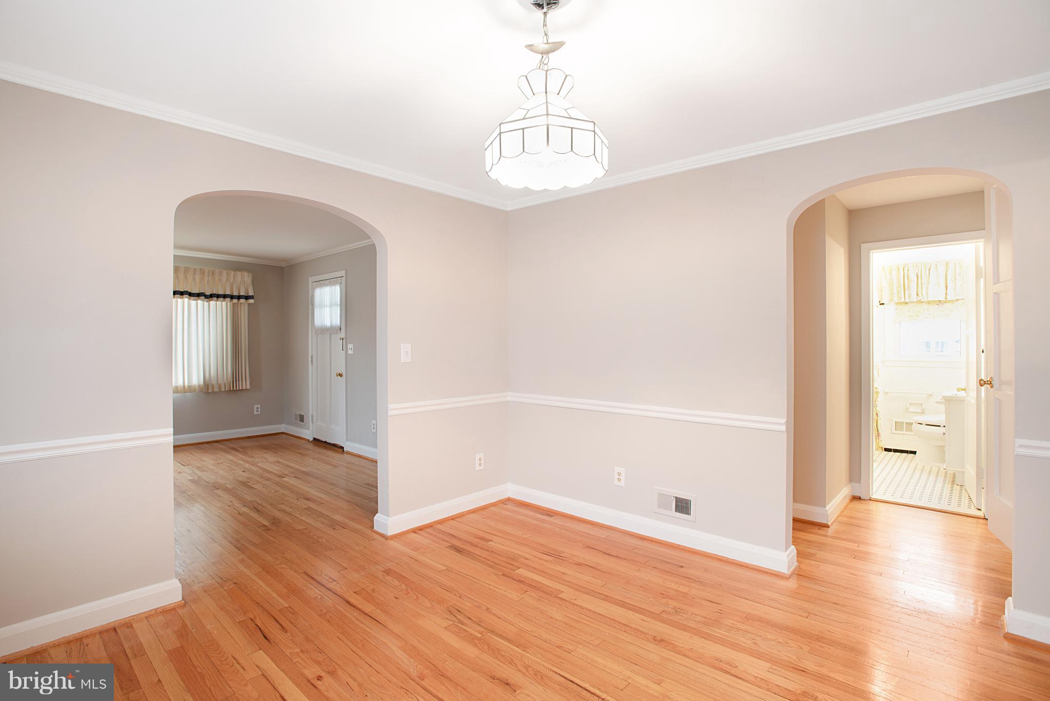 3300 Garnet Road Baltimore, MD 21234 - Photo 14 of 55 a view of an empty room with wooden floor and a window