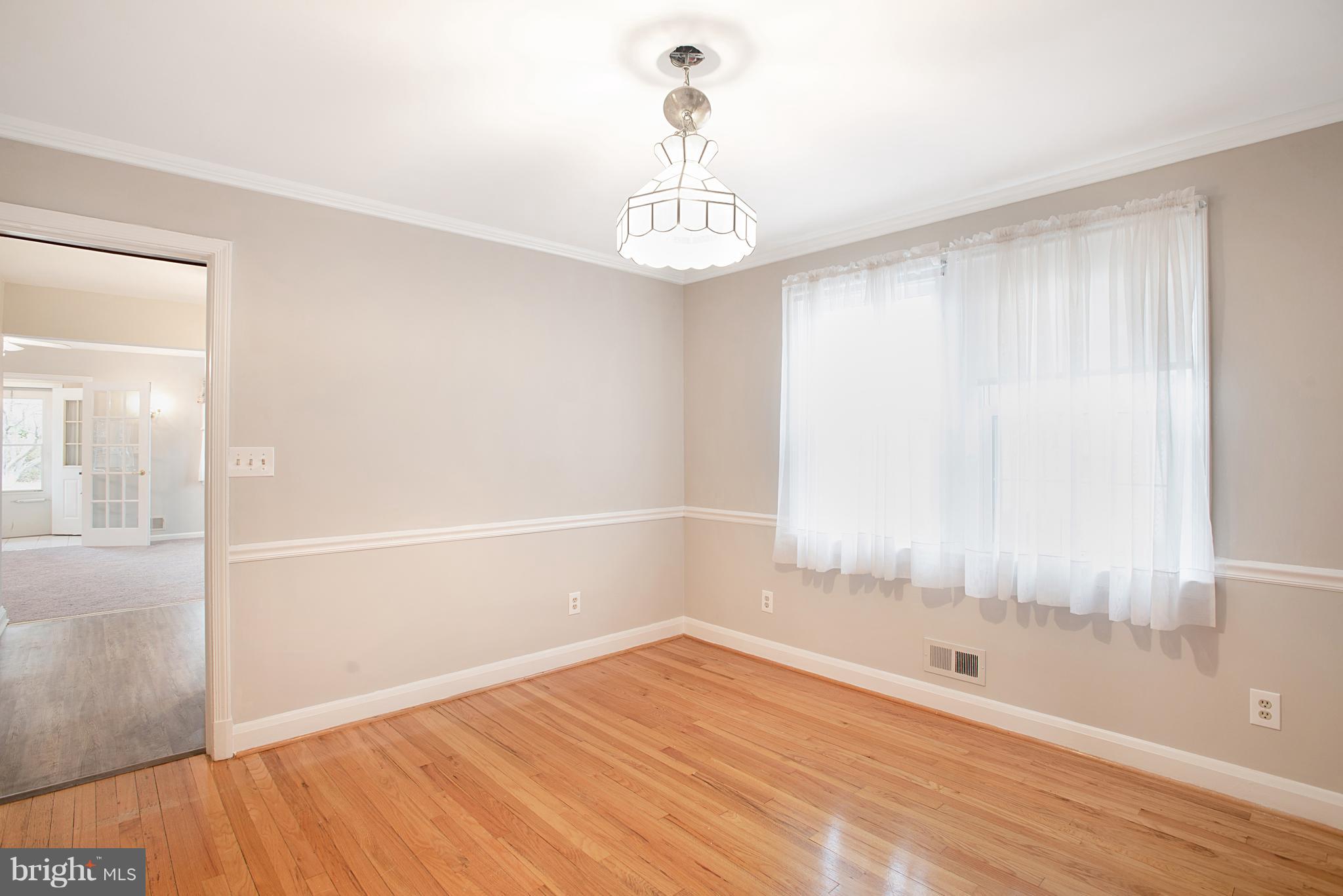3300 Garnet Road Baltimore, MD 21234 - Photo 15 of 55 a view of an empty room with wooden floor and a window