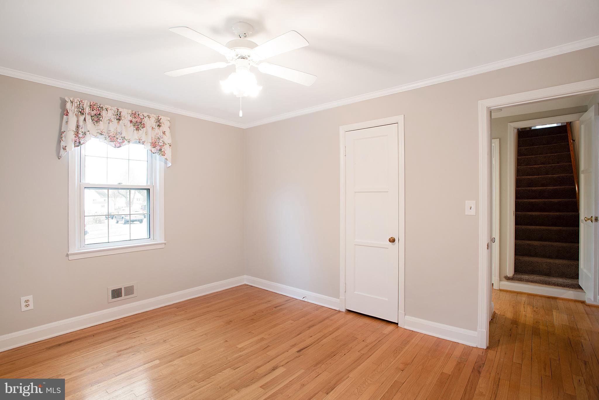 3300 Garnet Road Baltimore, MD 21234 - Photo 17 of 55 wooden floor in an empty room with a window