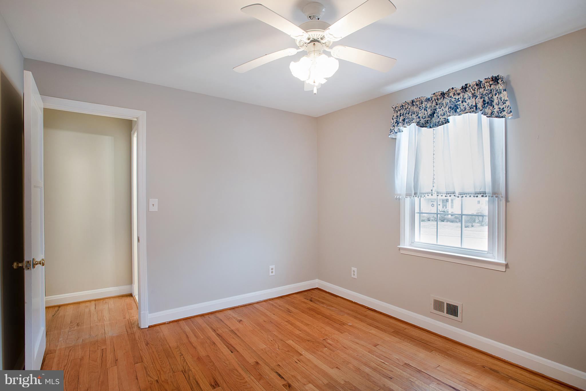 3300 Garnet Road Baltimore, MD 21234 - Photo 20 of 55 a view of an empty room with wooden floor and a window