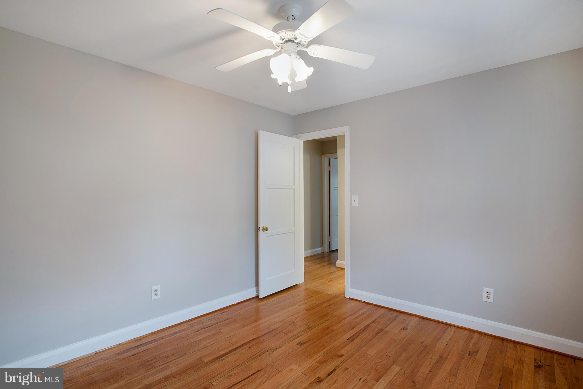 3300 Garnet Road Baltimore, MD 21234 - Photo 21 of 55 a view of an empty room with window and wooden floor