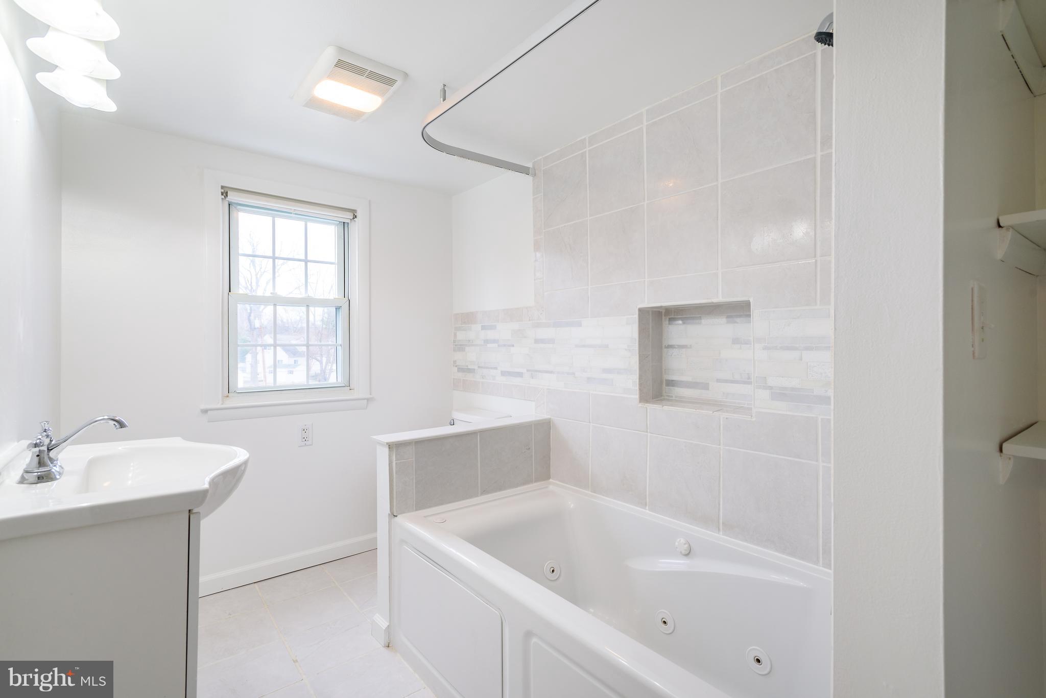 3300 Garnet Road Baltimore, MD 21234 - Photo 26 of 55 a white bath tub sitting next to a white sink