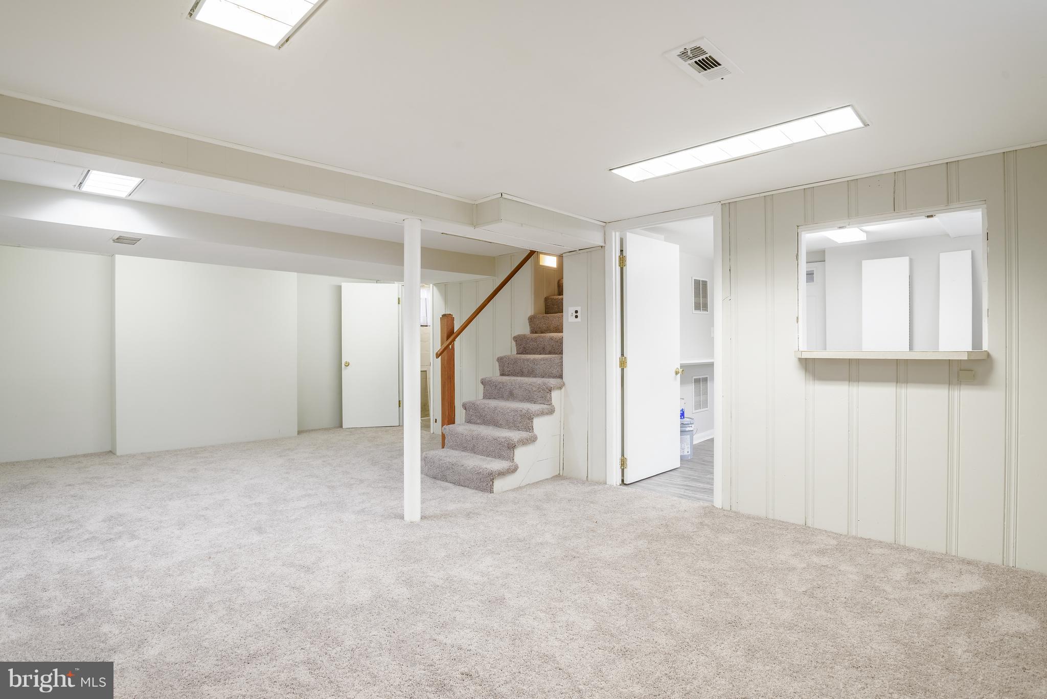 3300 Garnet Road Baltimore, MD 21234 - Photo 29 of 55 an empty room with staircase and white walls