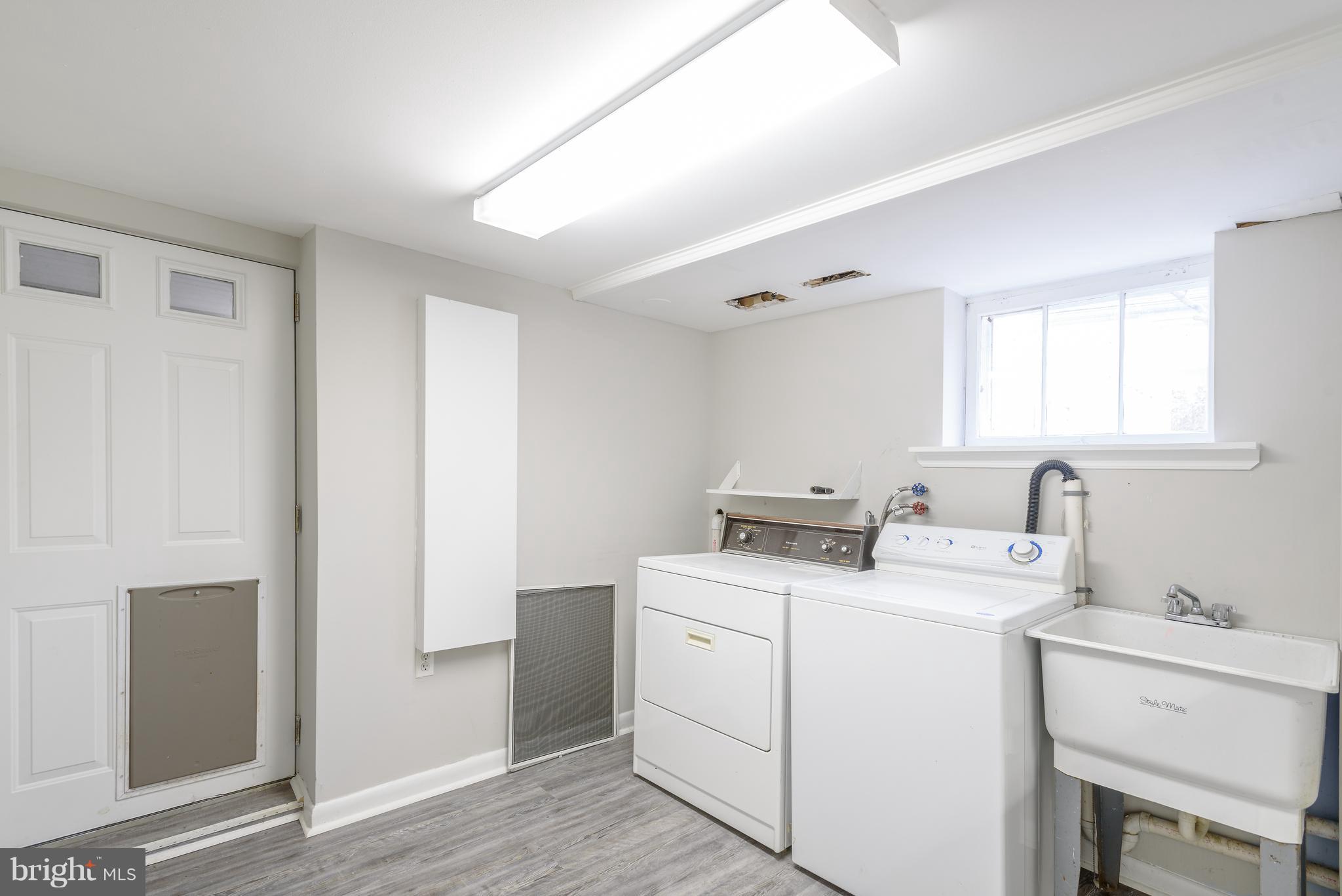3300 Garnet Road Baltimore, MD 21234 - Photo 33 of 55 a view of storage and utility room with washer and dryer