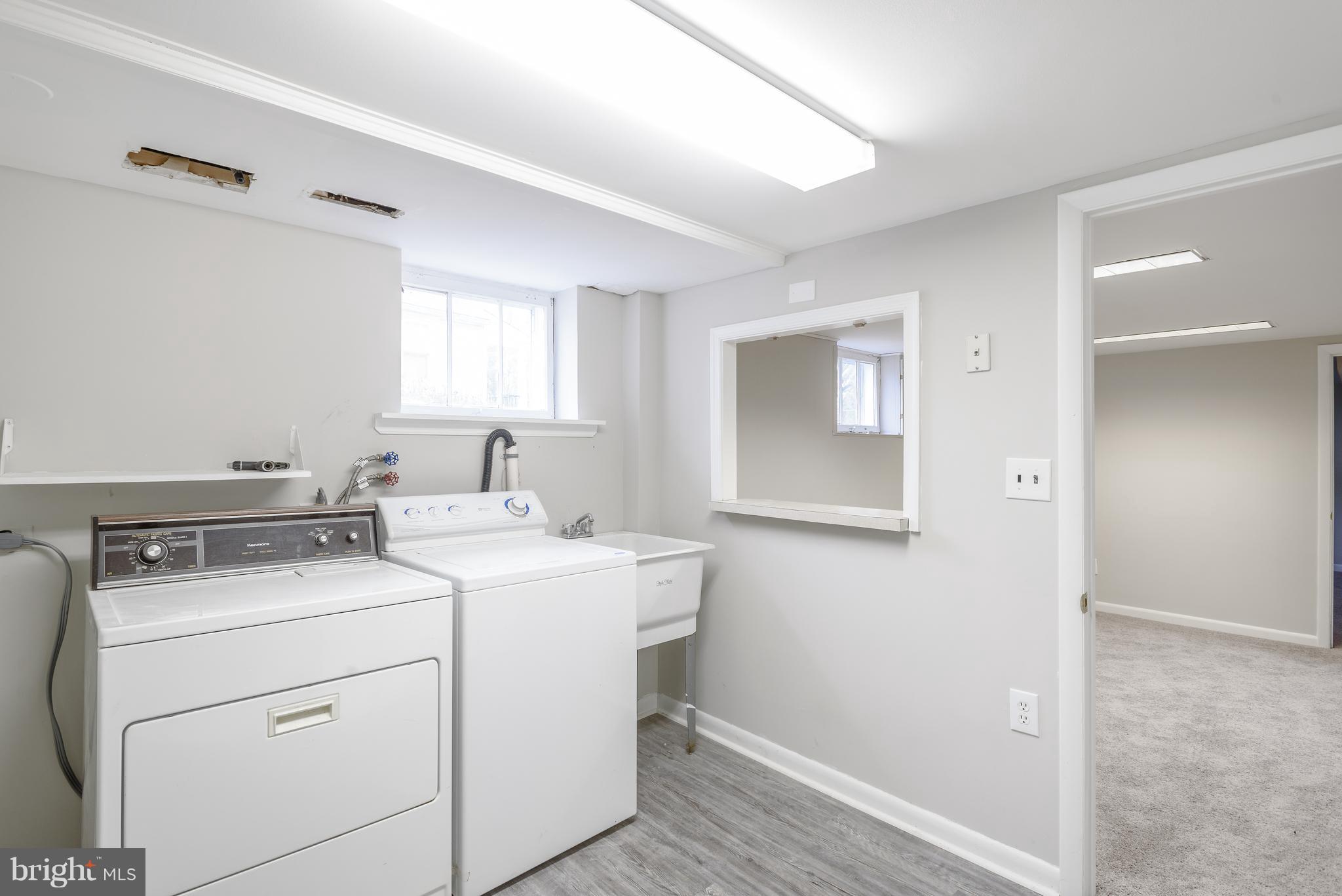 3300 Garnet Road Baltimore, MD 21234 - Photo 42 of 55 a utility room with dryer and washer