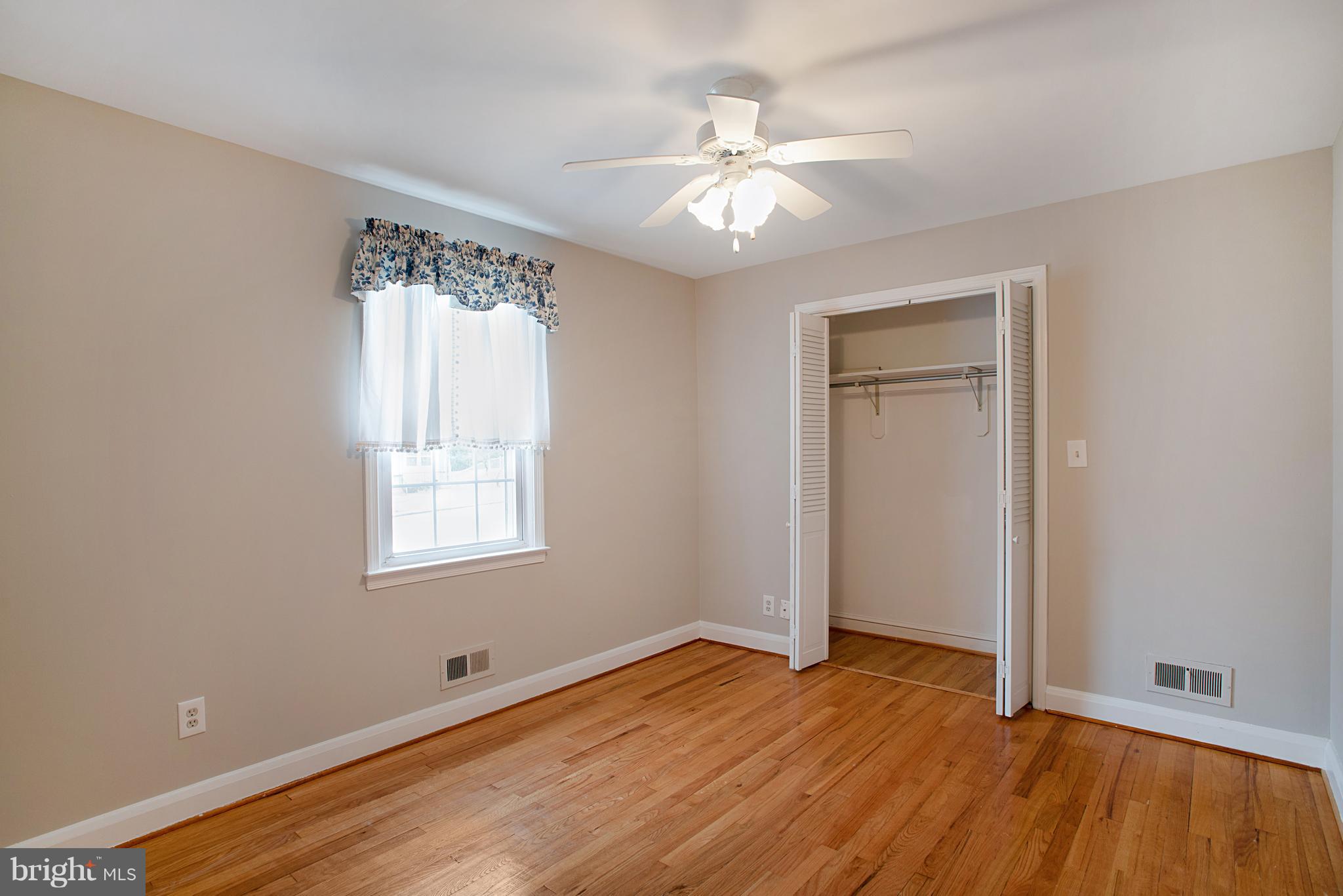3300 Garnet Road Baltimore, MD 21234 - Photo 44 of 55 a view of an empty room with wooden floor and a window