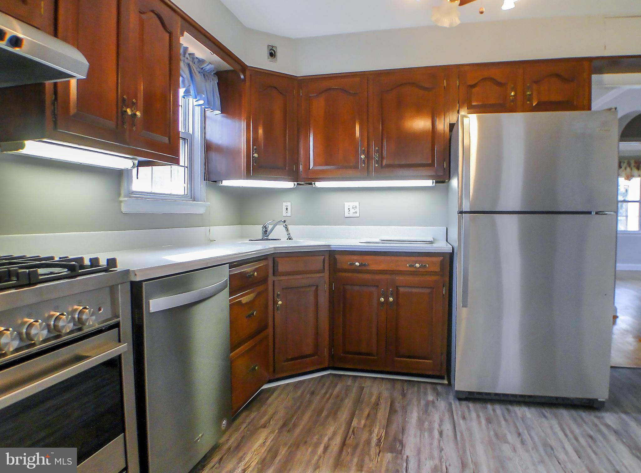 3300 Garnet Road Baltimore, MD 21234 - Photo 55 of 55 a kitchen with a refrigerator sink and cabinets