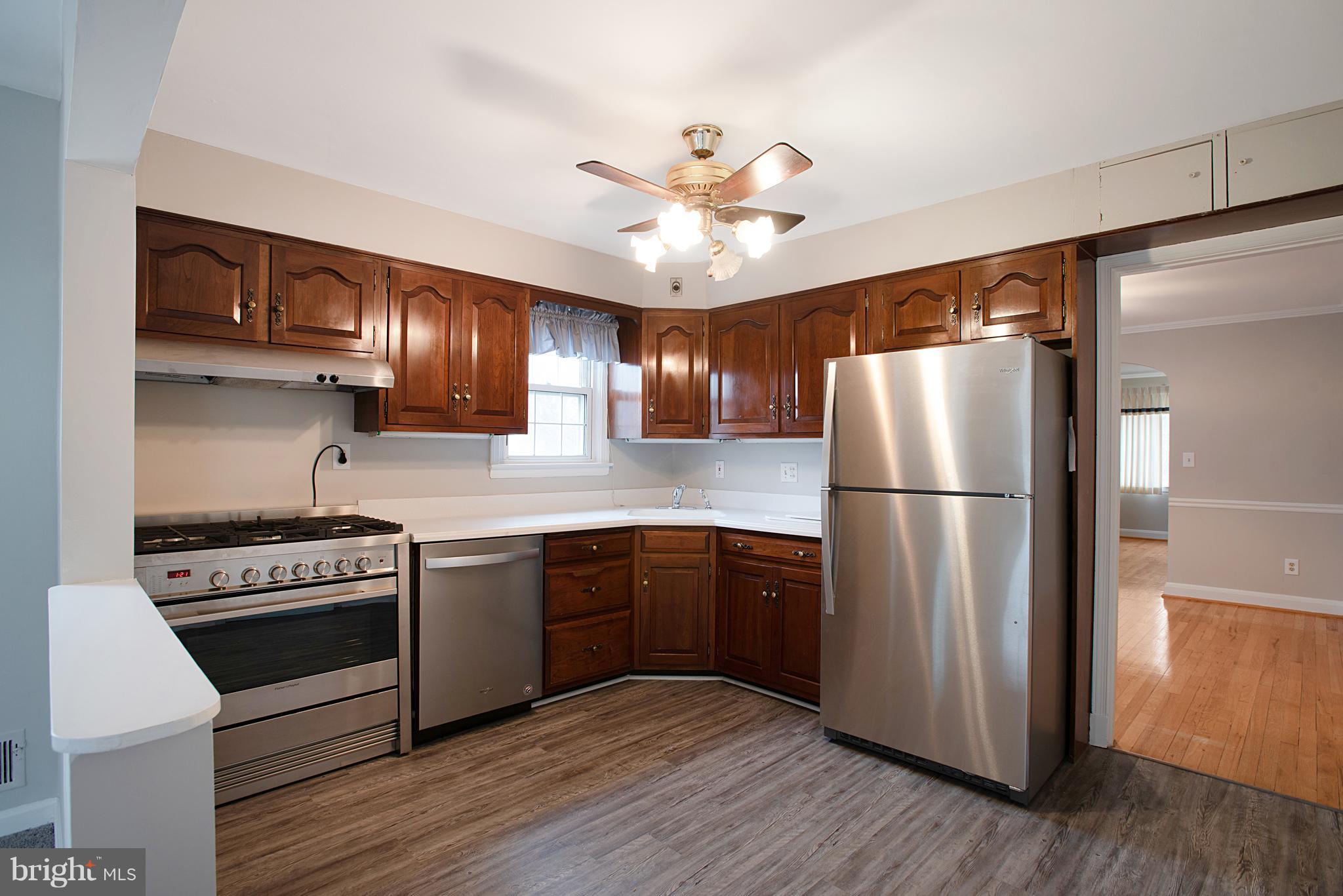 3300 Garnet Road Baltimore, MD 21234 - Photo 8 of 55 a kitchen with stainless steel appliances granite countertop a stove a refrigerator and a refrigerator