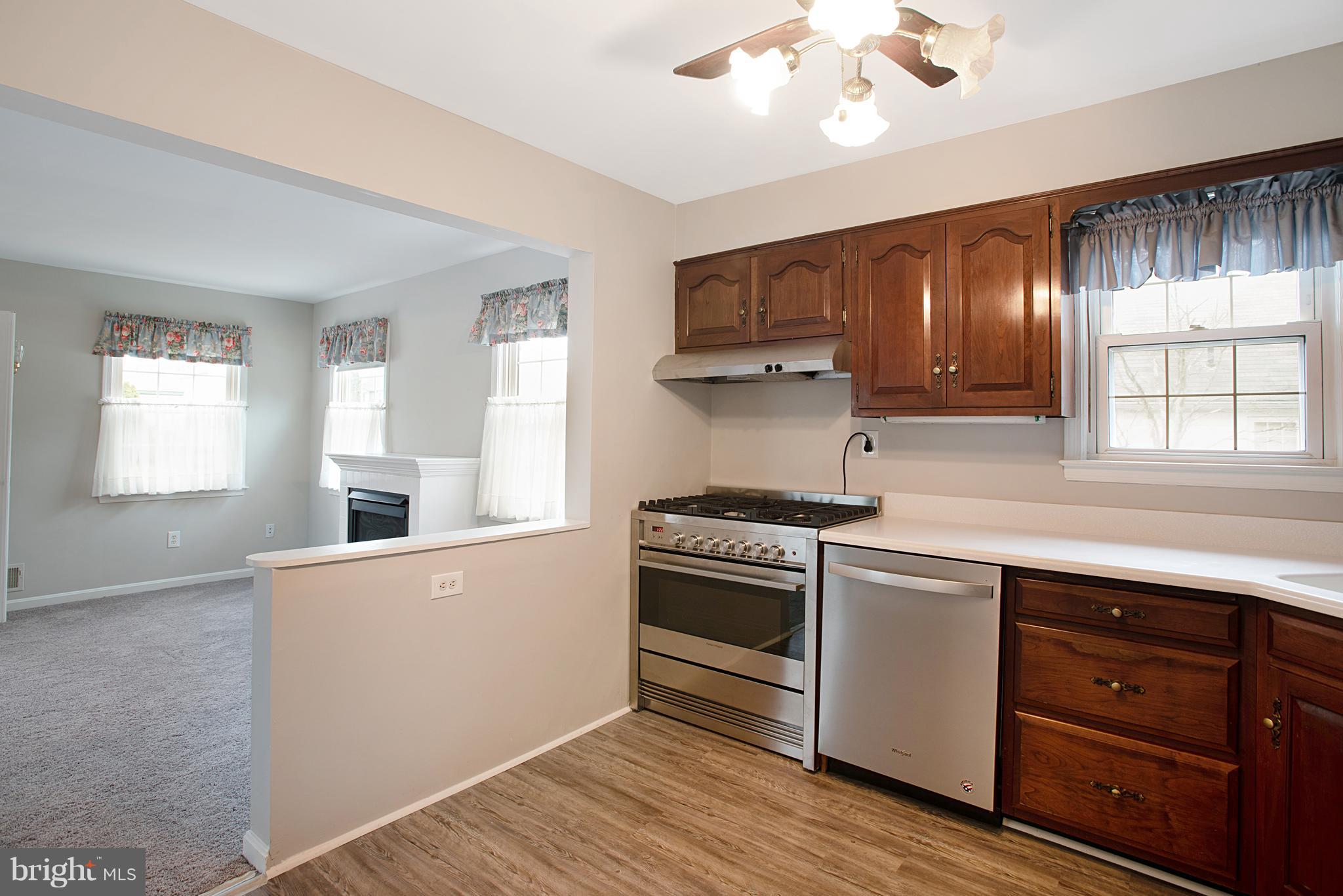 3300 Garnet Road Baltimore, MD 21234 - Photo 9 of 55 a kitchen with granite countertop white cabinets and white appliances