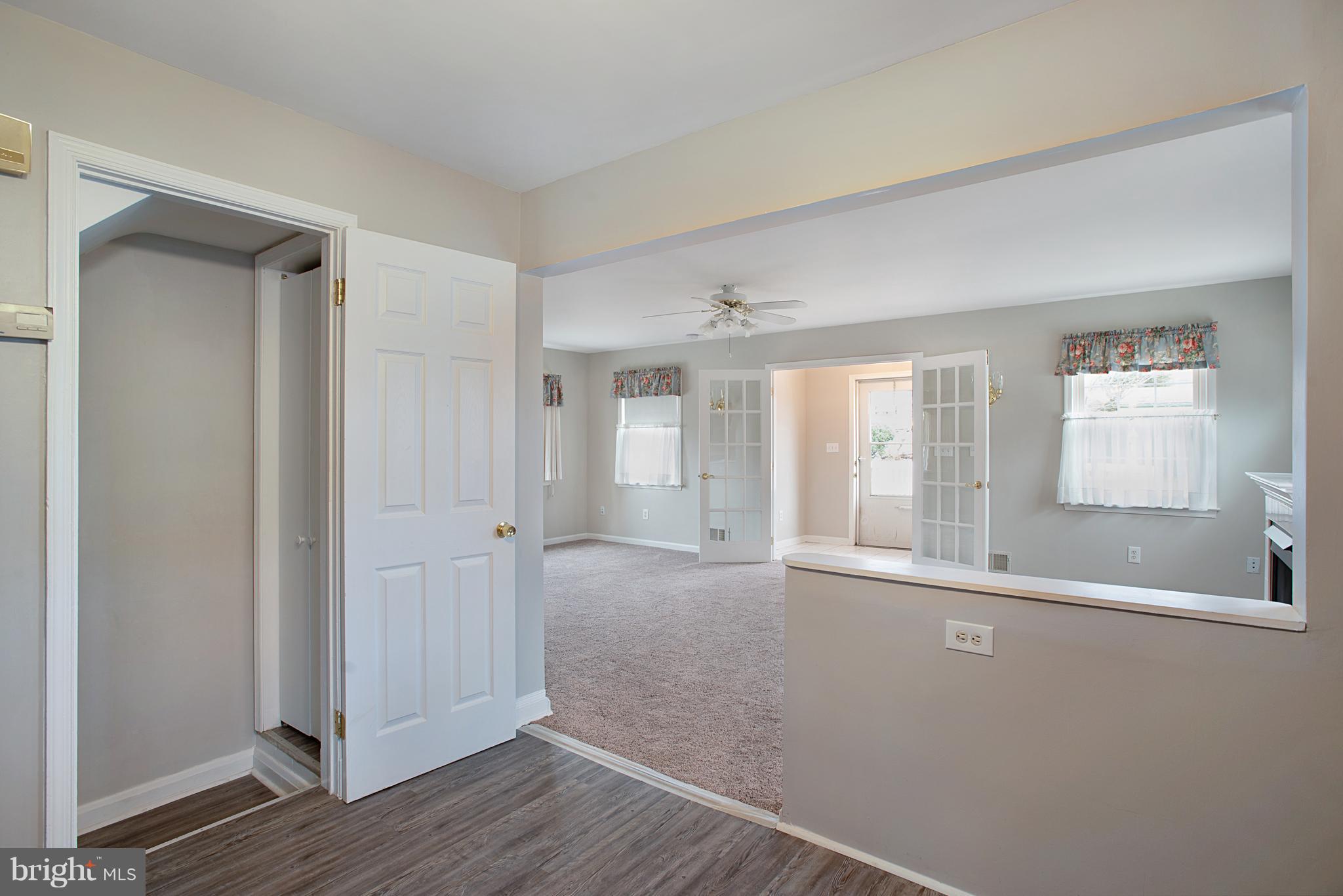3300 Garnet Road Baltimore, MD 21234 - Photo 10 of 55 a view of an empty room with wooden floor and a window