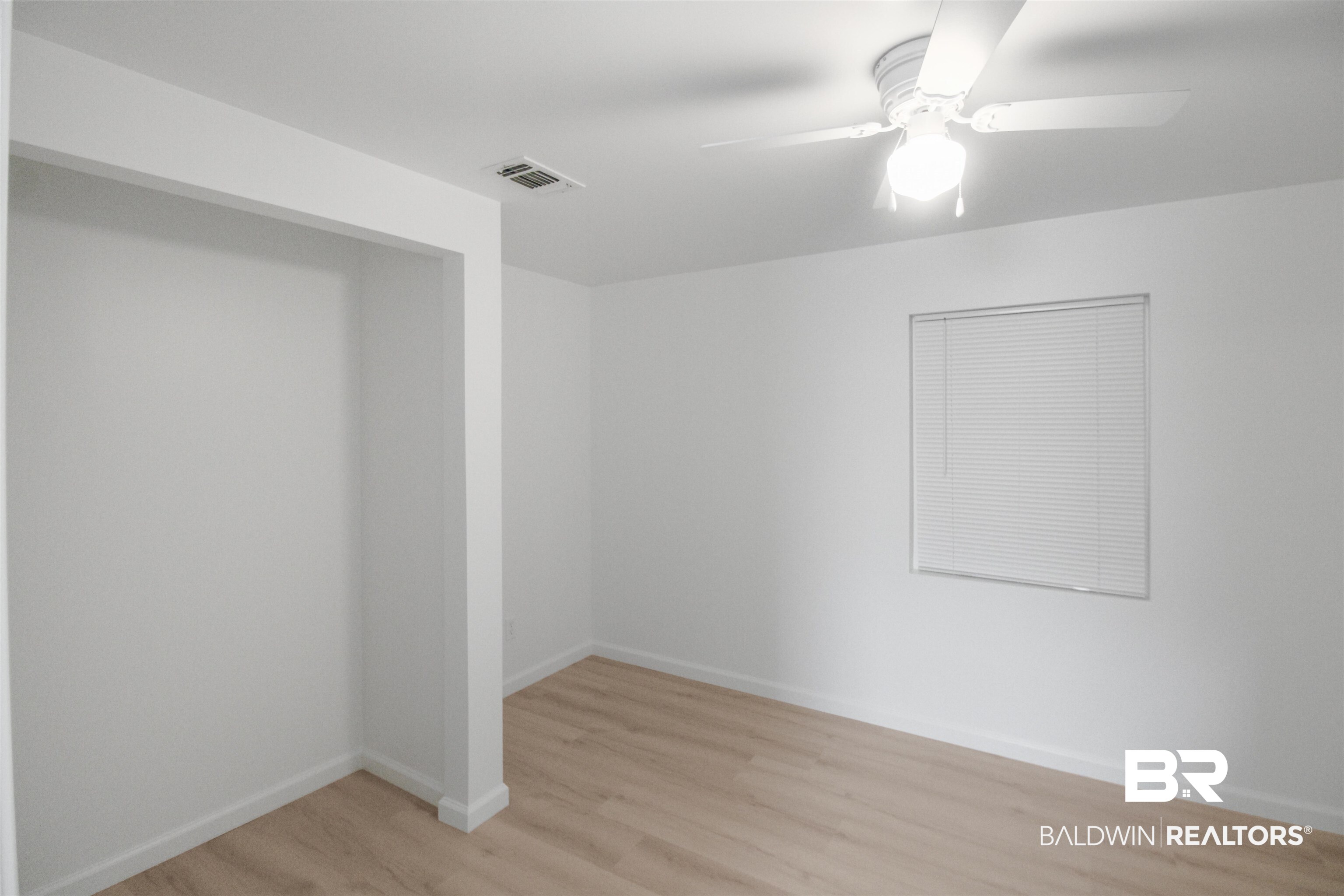 17622 Brewer Road Foley, AL 36535 - Photo 8 of 26 Spare room with ceiling fan and light wood-type flooring