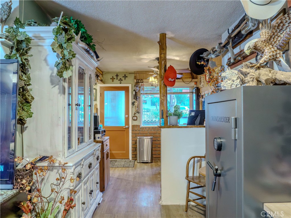 9413 Garfield Street Riverside, CA 92503 - Photo 12 of 33 an entryway with wooden floor and windows
