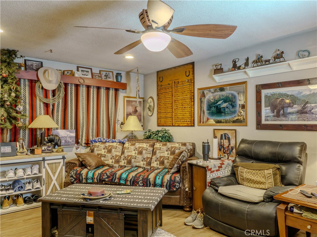 9413 Garfield Street Riverside, CA 92503 - Photo 18 of 33 a living room with furniture and a large window