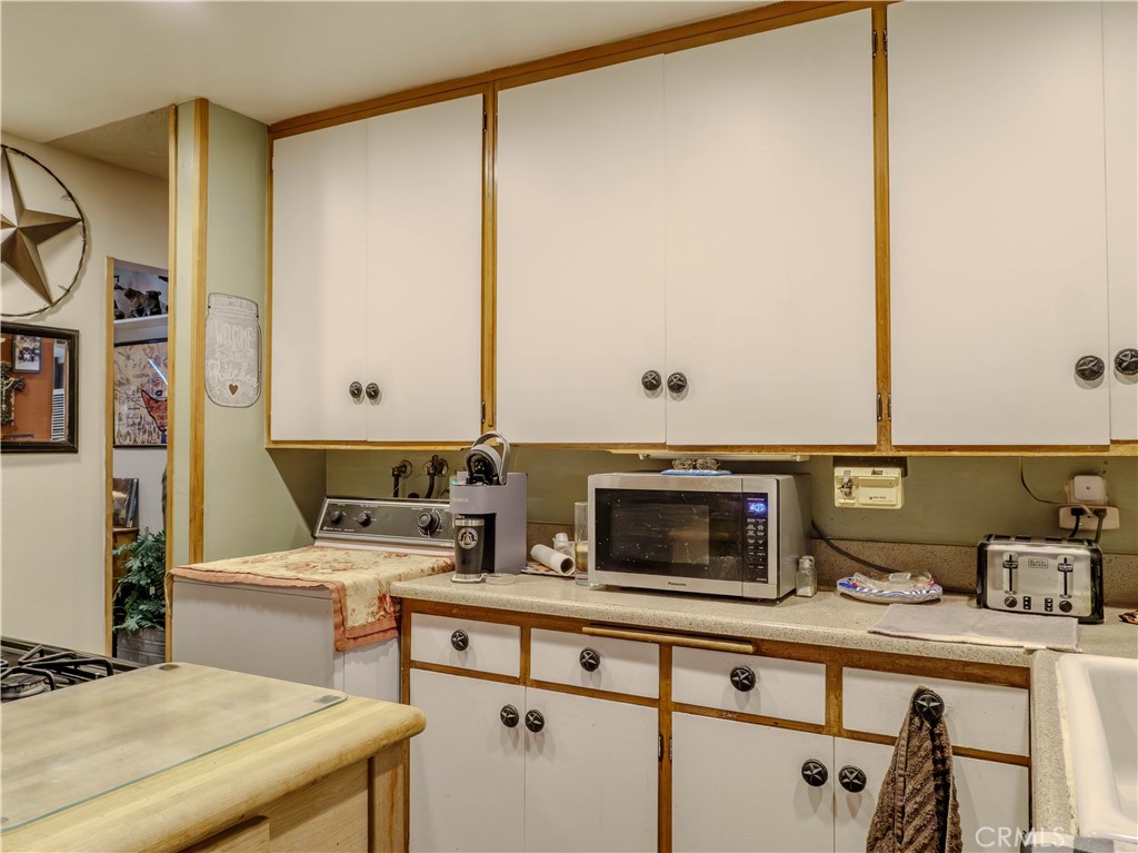 9413 Garfield Street Riverside, CA 92503 - Photo 20 of 33 a work place with a desk and chair with wooden floor