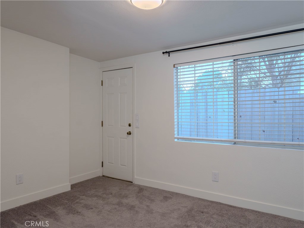 9413 Garfield Street Riverside, CA 92503 - Photo 4 of 33 a view of an empty room with a window