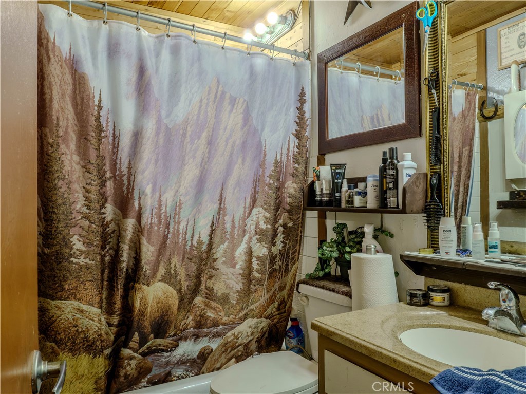 9413 Garfield Street Riverside, CA 92503 - Photo 9 of 33 a bathroom with a sink toilet and shower