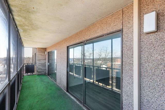 a porch with a glass door