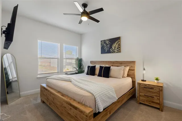 a bedroom with bed and window