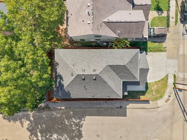 an aerial view of a house with a swimming pool