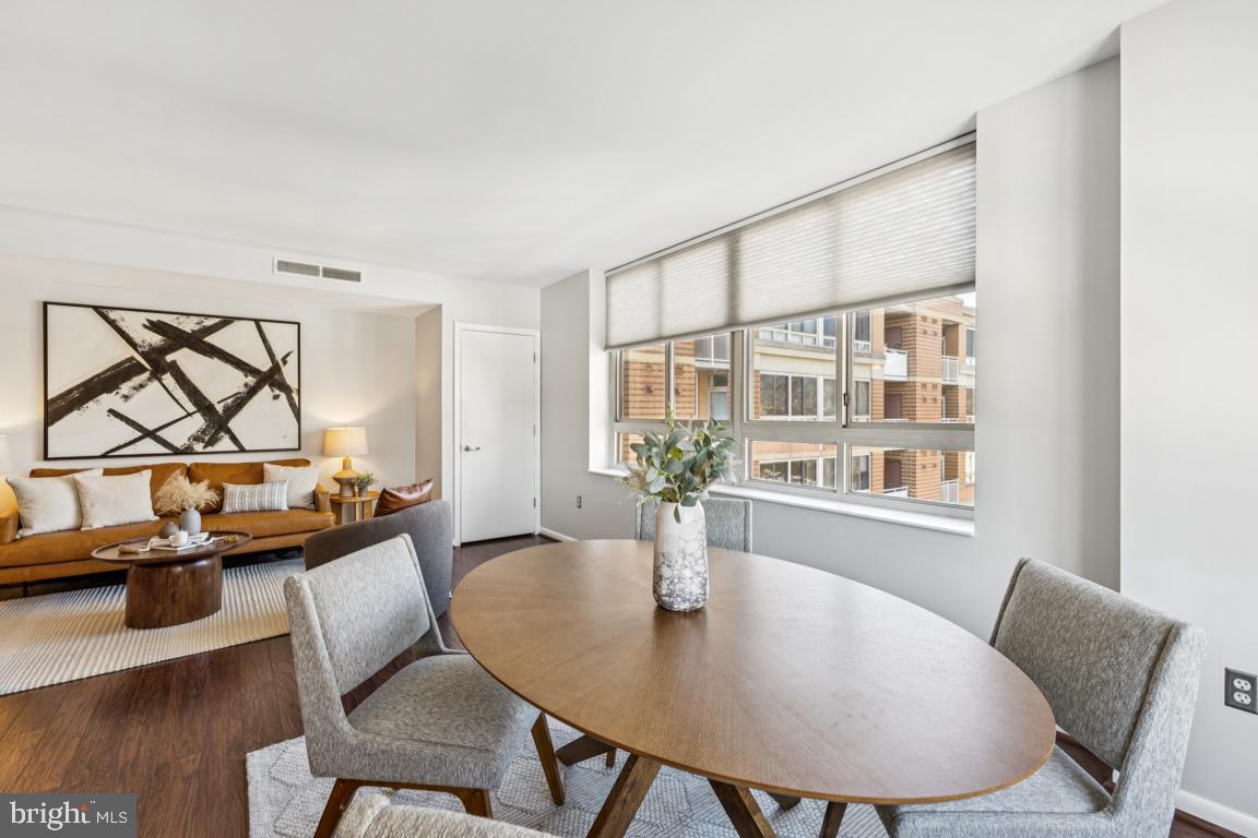 355 I Street Southwest, Unit 501 Washington, DC 20024 - Photo 12 of 44 a view of a dining room with furniture and wooden floor