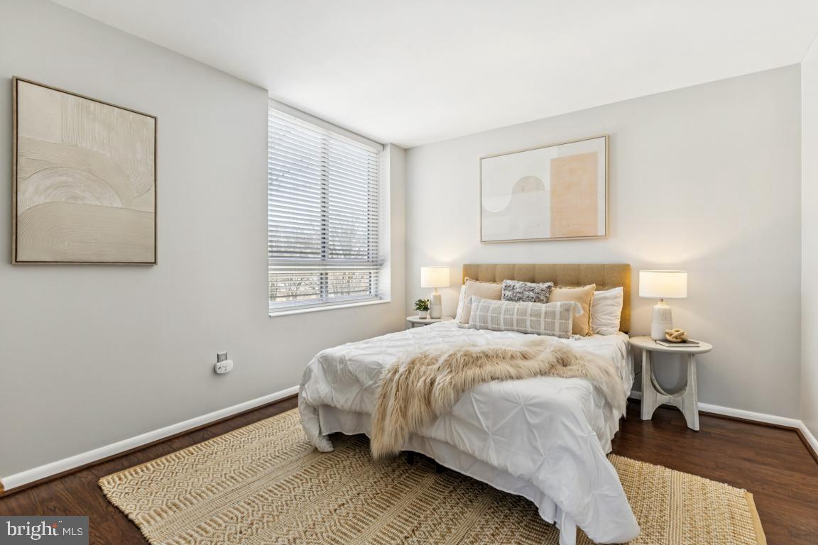 355 I Street Southwest, Unit 501 Washington, DC 20024 - Photo 16 of 44 a bedroom with a bed and a window