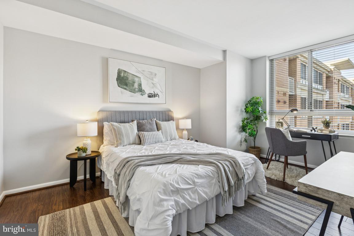 355 I Street Southwest, Unit 501 Washington, DC 20024 - Photo 21 of 44 a bedroom with a bed and a table