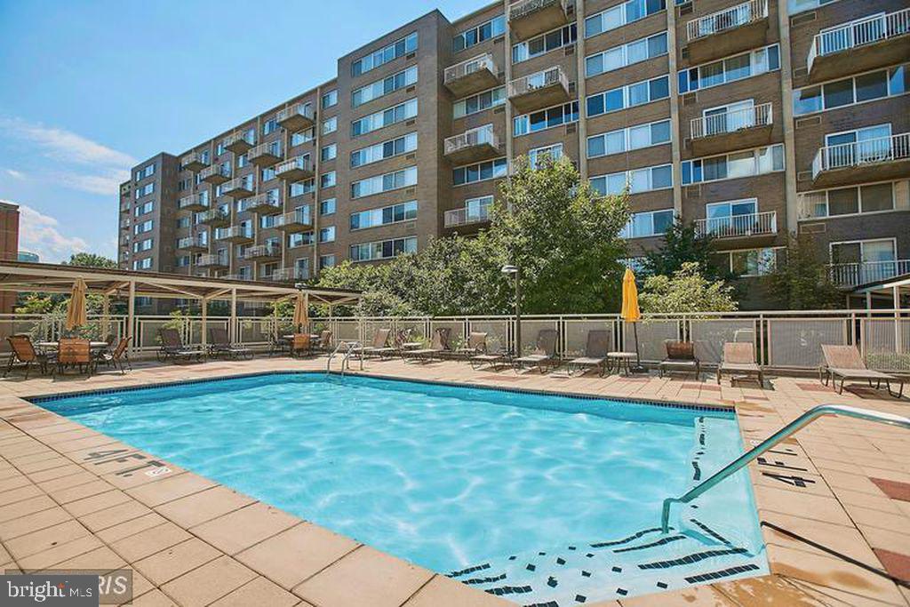 355 I Street Southwest, Unit 501 Washington, DC 20024 - Photo 37 of 44 a view of building with swimming pool and sitting area