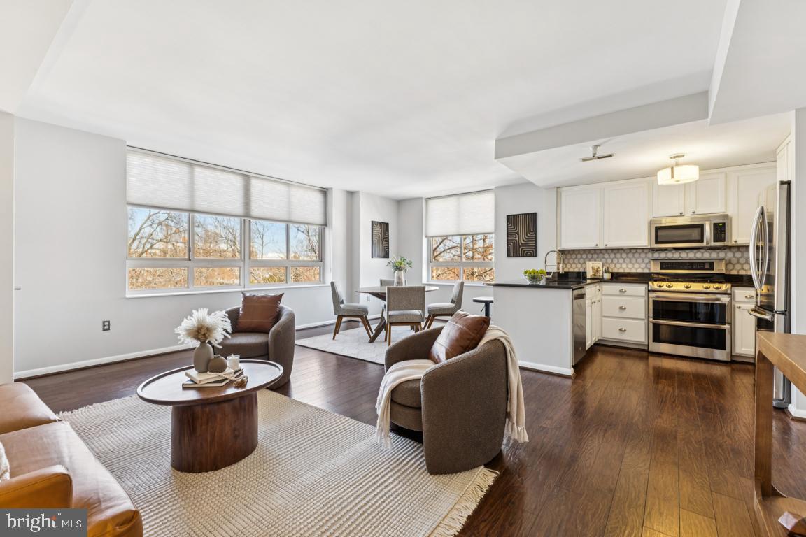 355 I Street Southwest, Unit 501 Washington, DC 20024 - Photo 6 of 44 a living room with furniture and a kitchen