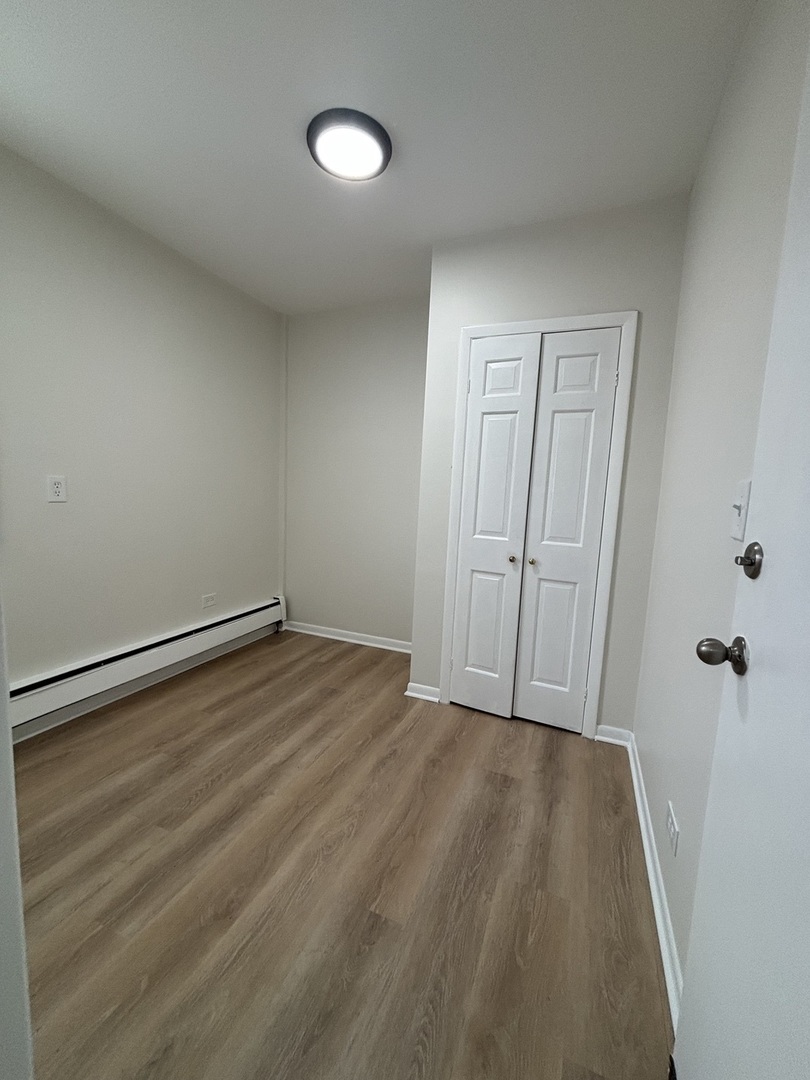 10401 South Ewing Avenue, Unit 2R Chicago, IL 60617 - Photo 6 of 8 a view of room with hardwood floor