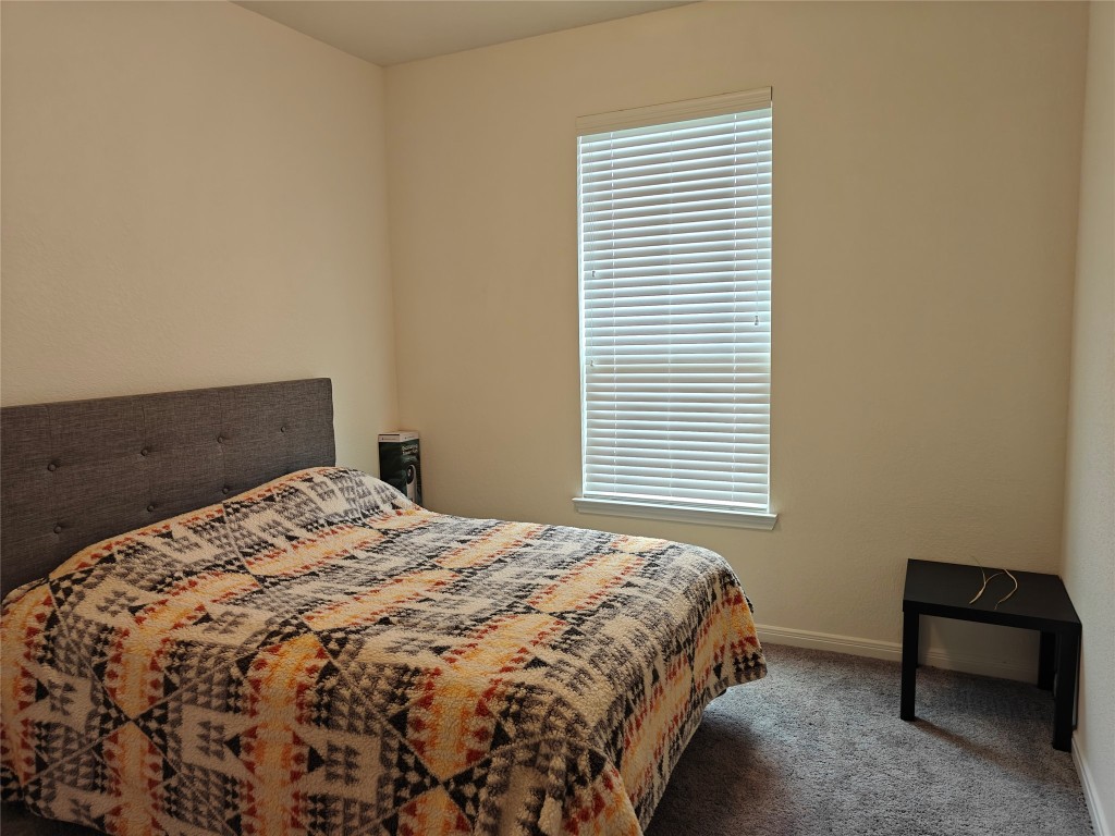 1270 Glendora Drive Rosharon, TX 77583 - Photo 13 of 43 a bedroom with a bed and a window