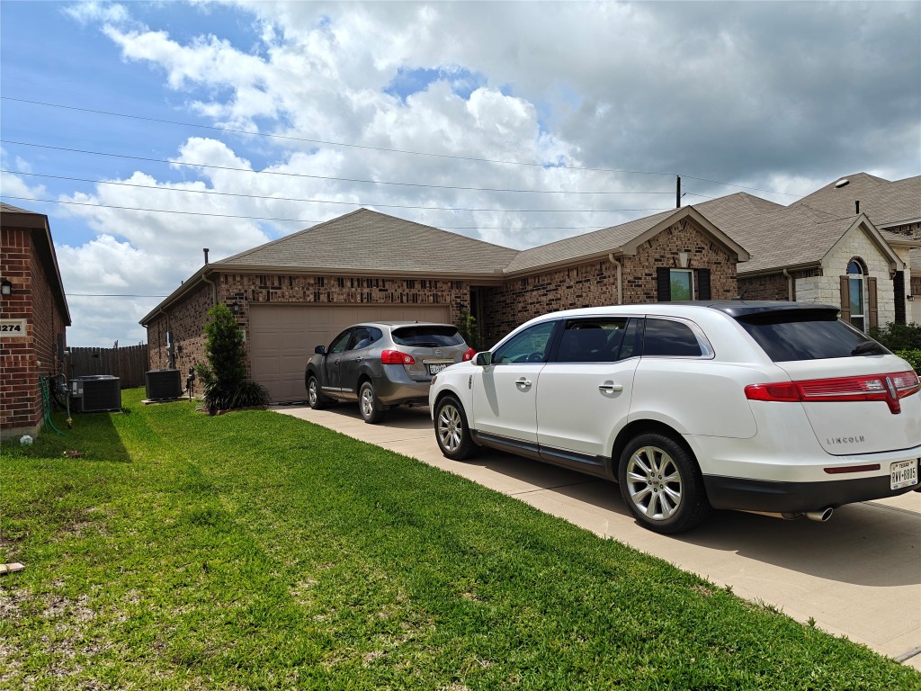 1270 Glendora Drive Rosharon, TX 77583 - Photo 40 of 43 a front view of a house with a garden and parking space