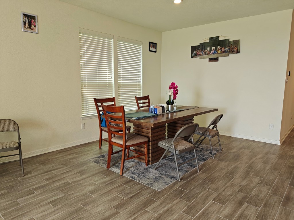 1270 Glendora Drive Rosharon, TX 77583 - Photo 5 of 43 a view of a dining room with furniture and wooden floor
