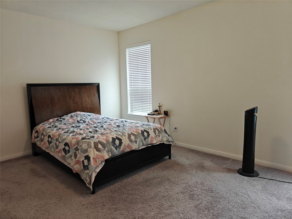 1270 Glendora Drive Rosharon, TX 77583 - Photo 10 of 43 a bed sitting in a room next to a window