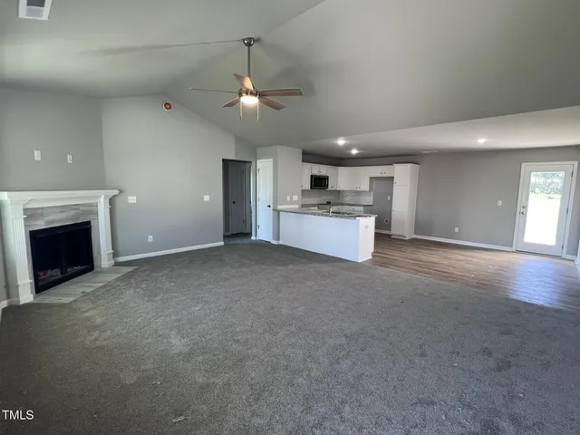 a view of a kitchen with a stove cabinets and a fireplace