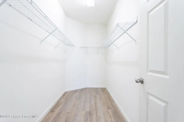 a view of a room with racks on the wall