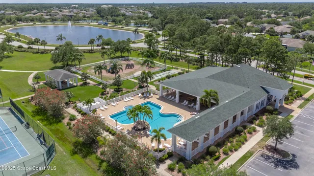 a view of a swimming pool with a lounge chairs