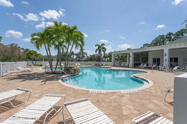 a large kitchen with stainless steel appliances granite countertop a stove a sink and a microwave