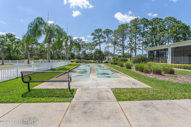 a view of a lake with houses in the background