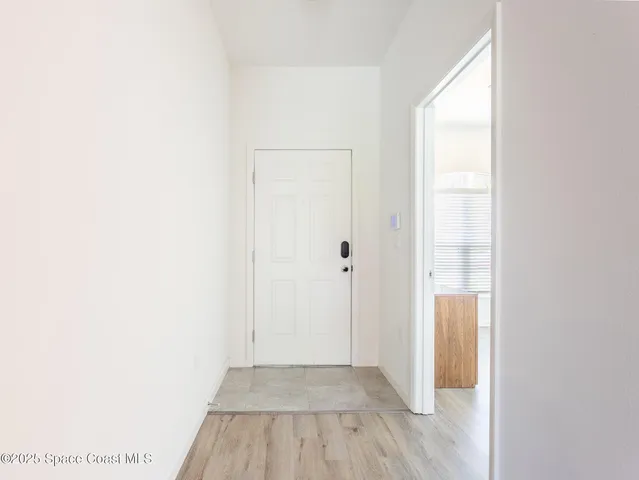 a view of a room that has a window in it