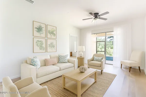 a living room with furniture and a window