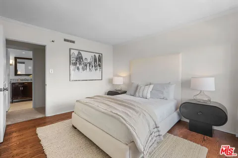 a bed room with a bed and a window
