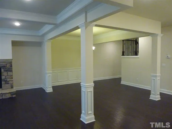 an empty room with wooden floor
