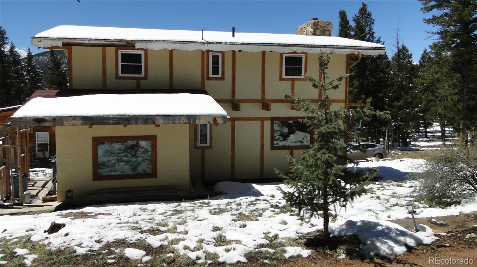 600 Forest Drive Bailey, CO 80421 - Photo 3 of 8 a front view of a house with a yard