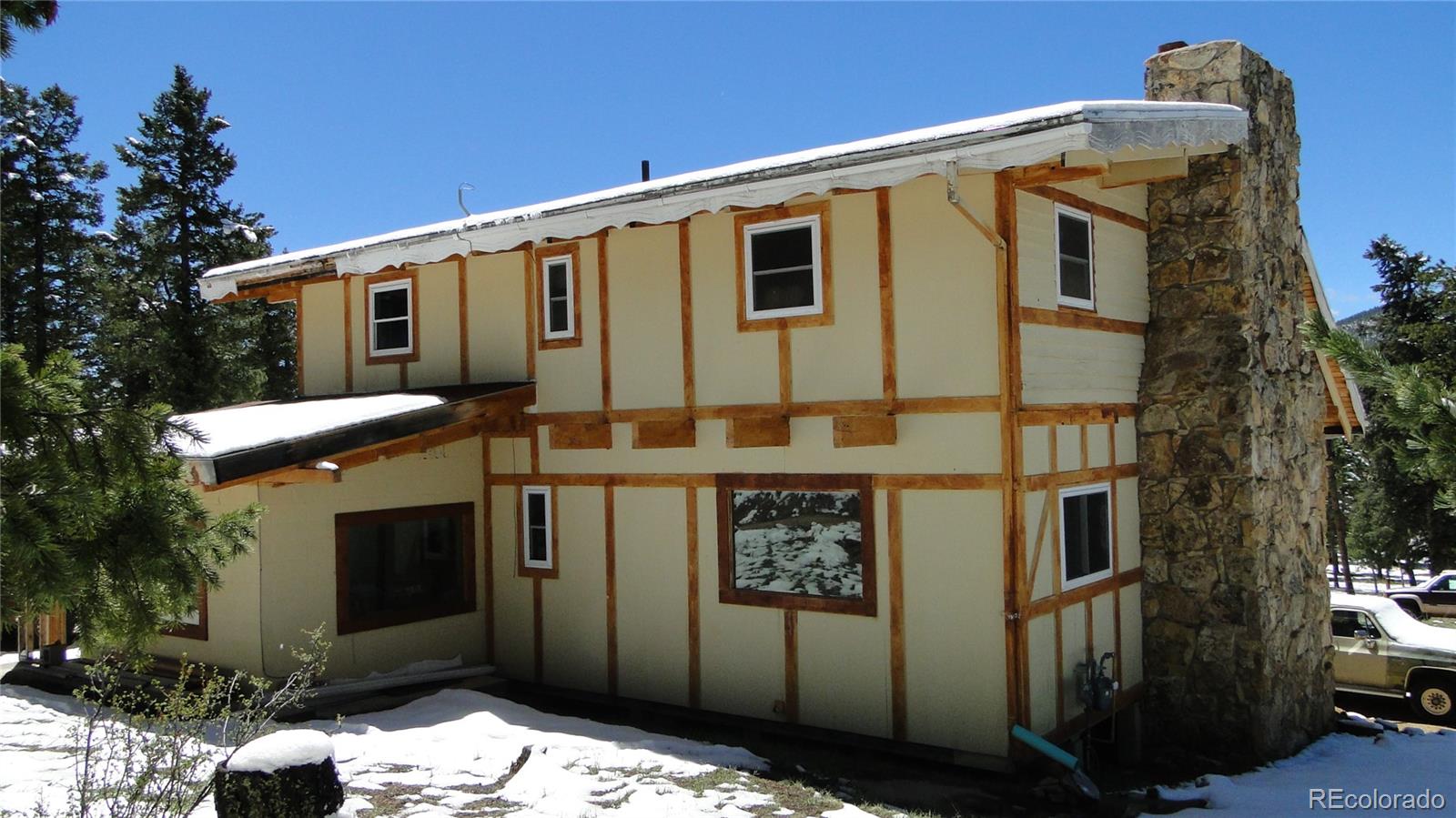 600 Forest Drive Bailey, CO 80421 - Photo 7 of 8 a front view of a house with a tree