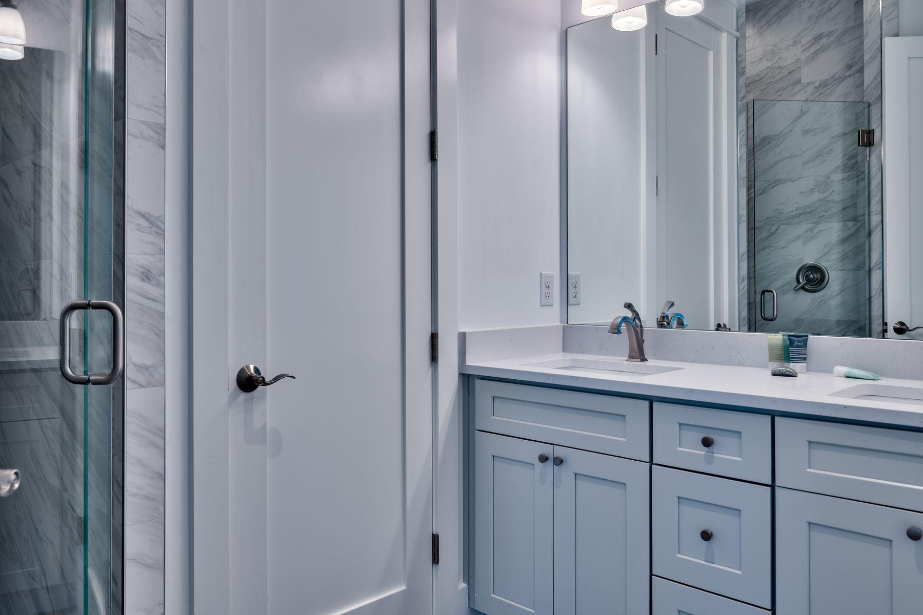 37 West Seahorse Circle Santa Rosa Beach, FL 32459 - Photo 20 of 44 a bathroom with a double vanity sink and mirror